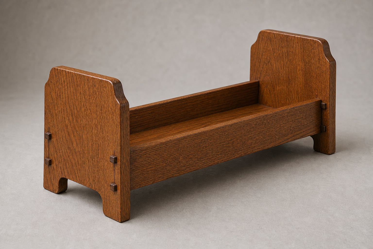 Mission-style oak book trough with wedge joints and a curved base cutout holding books