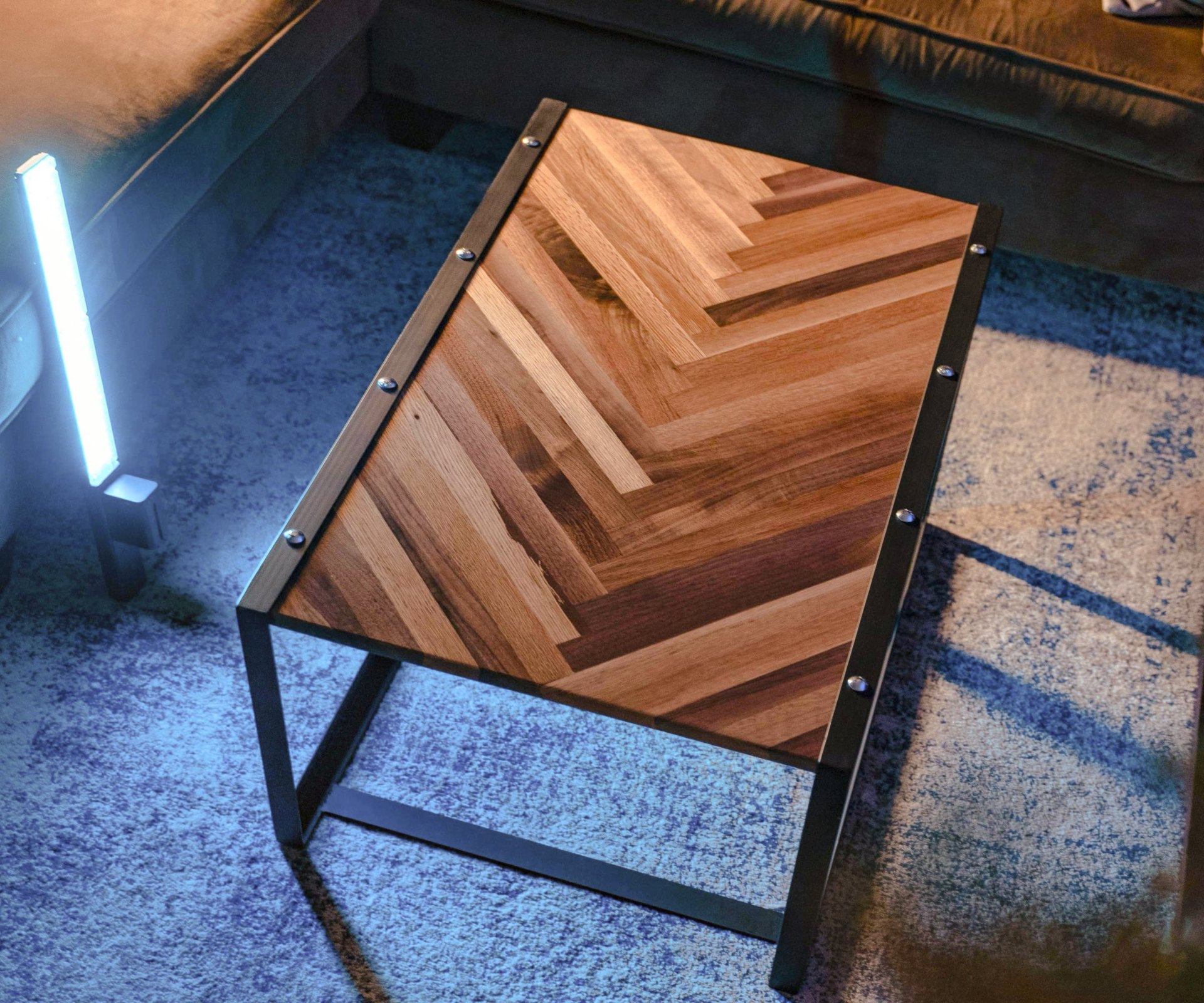 Finished herringbone coffee table top made from contrasting hardwood strips