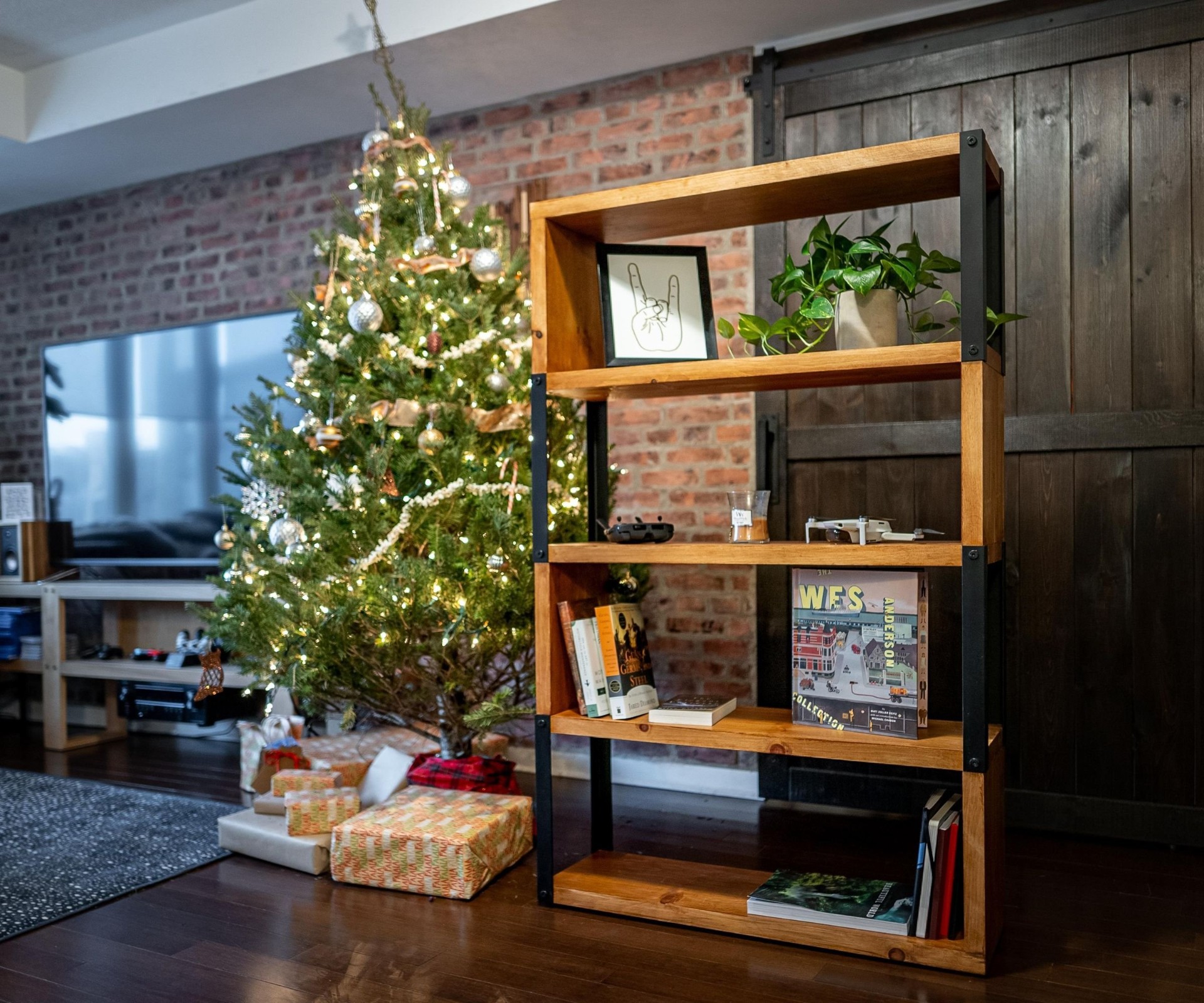 Finished industrial-style bookcase with wood shelves and black steel brackets