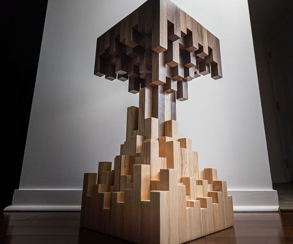Side table built from stacked oak and walnut blocks in a stepped pixel pattern